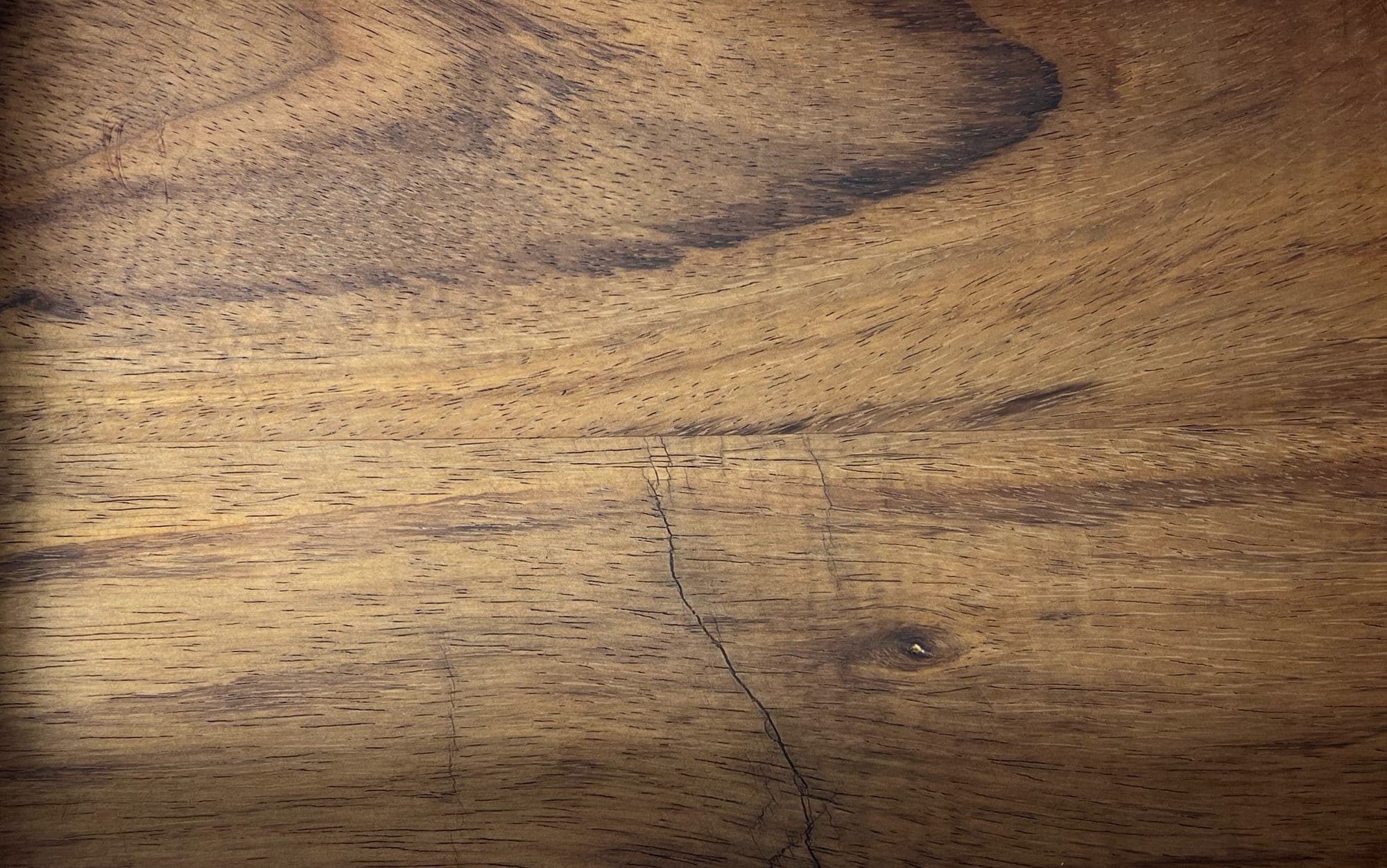 Heritage American Woodworks: dark walnut grain with a single sound knot